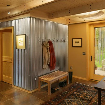 Corrugated metal accent wall by Timber and Tin