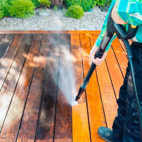 Pressure washing a wooden deck