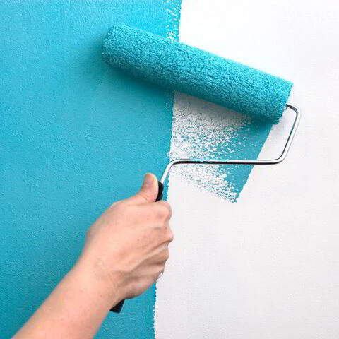 Painting a wall with a roller